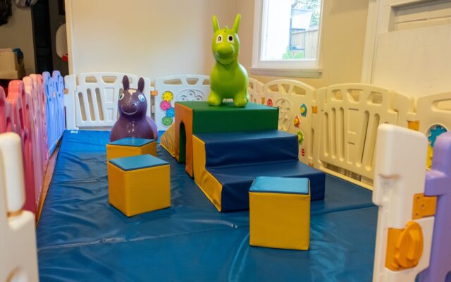 Colorful foam play blocks and animal figures in a children's play area.