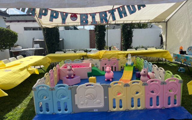 Colorful baby shower decorations with a 'It's a Boy' banner and vibrant table setup.